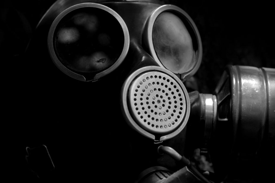 A picture of a gas mask on a dark back ground